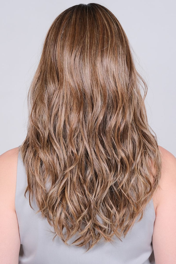 Back view of model showing off the loose and wavy curls of Tiger Sugar.