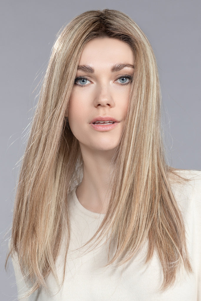 Woman wearing Boheme in the color Sandy Blonde Rooted by Ellen Wille.