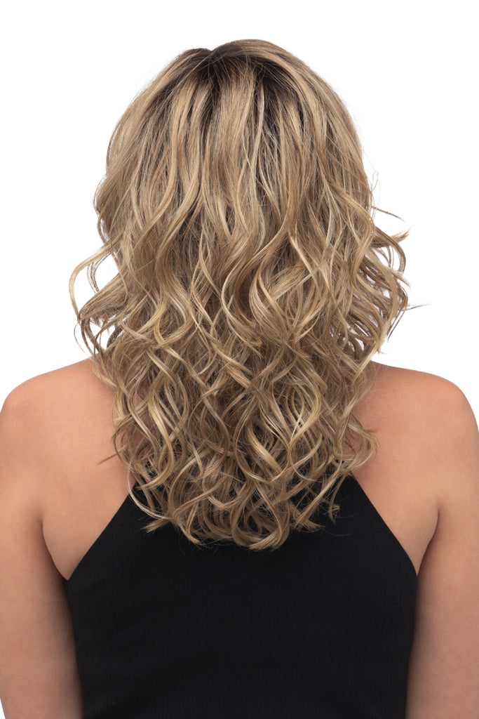 Women modeling the loose curls of this style for added texture and movement. 