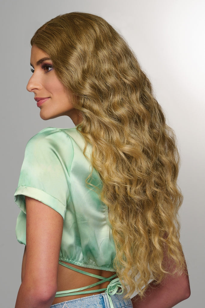 Side view of the long curly style. 