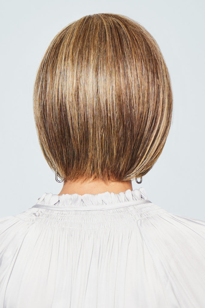 Back view of women wearing a bob with a tapered nape.