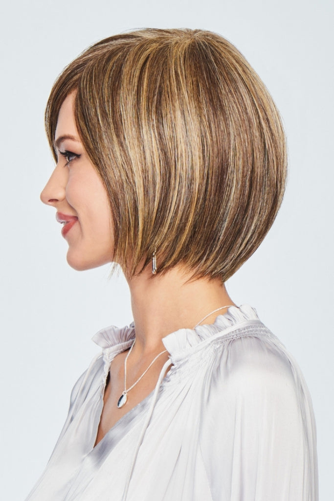 Side veiw of women wearing a wig in the color Glazed Mocha, Medium brown with honey highlights.