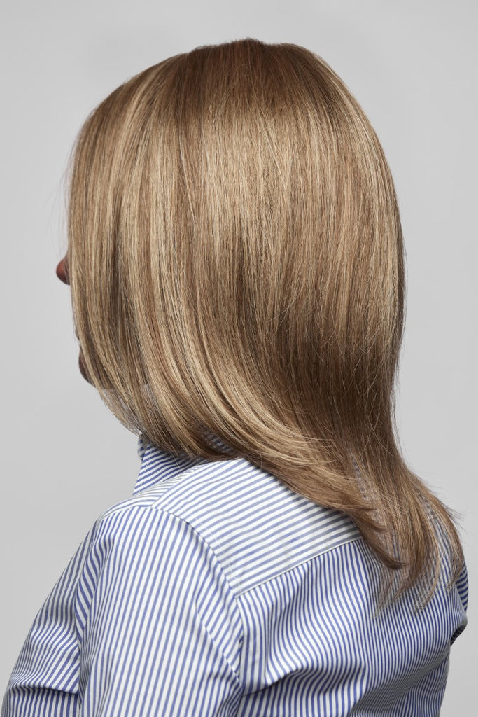 Back view of women wearing a long bob cut wig with synthetic hair fibers.