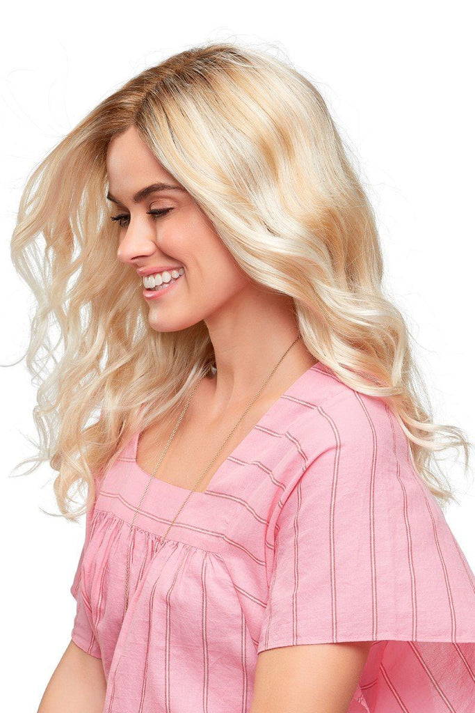 Vibrant woman laughing while wearing Jon Renau's curly long wig, Sarah in the color Laguna Blonde.