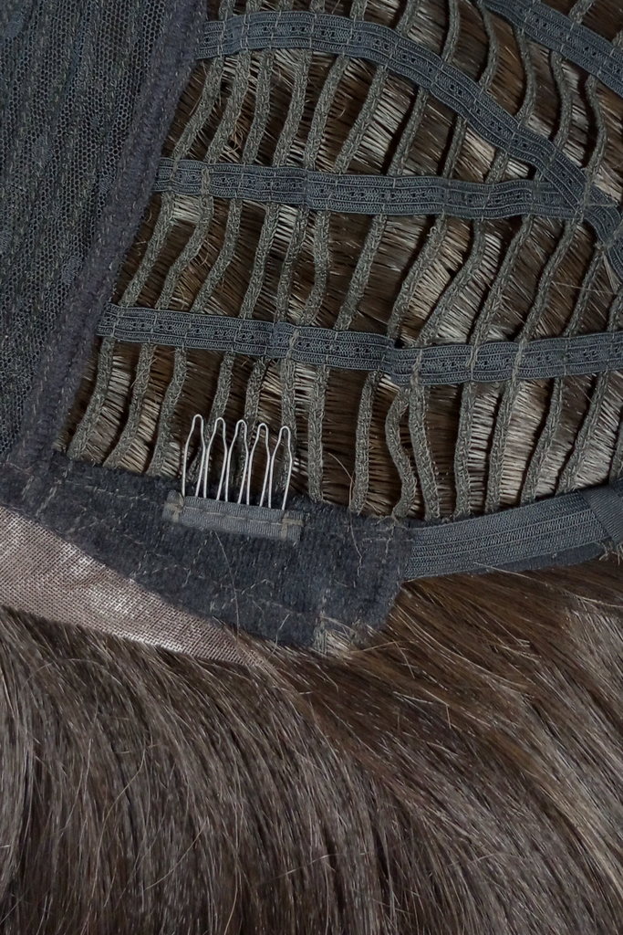 Close up of Kim Kimble Hailey cap construction, showing the comb attachments near the temple.