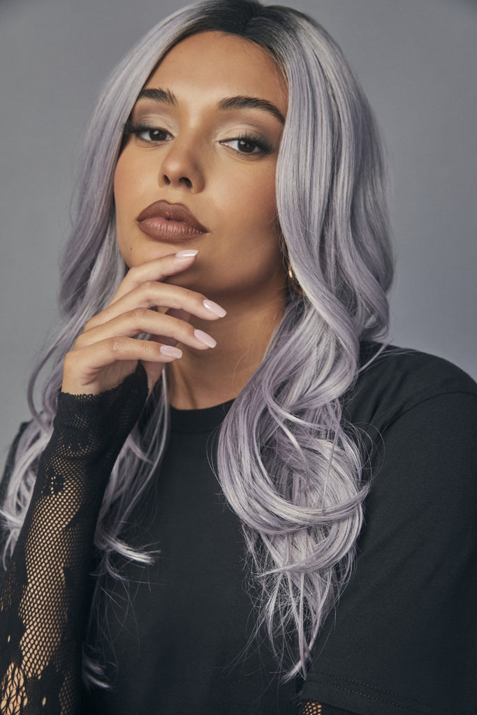 Women modeling curly wig from Muse Series in the color Lunar Haze.