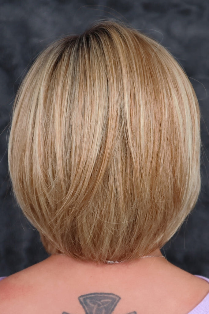 Model showing a wig with a subtle taper at the neck.