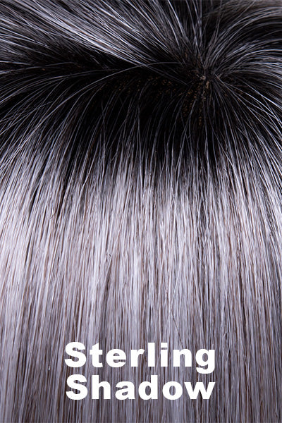 A blend of salt and pepper grey with dark brown roots.