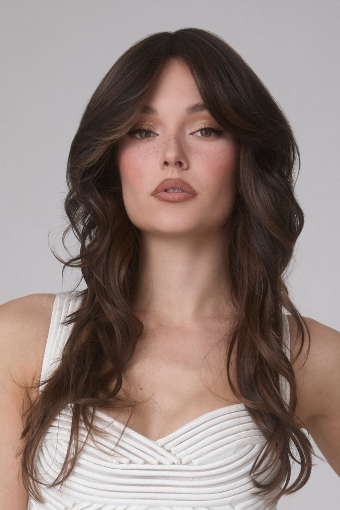 Woman wearing a wavy top piece in the color Spiced Mocha-R.