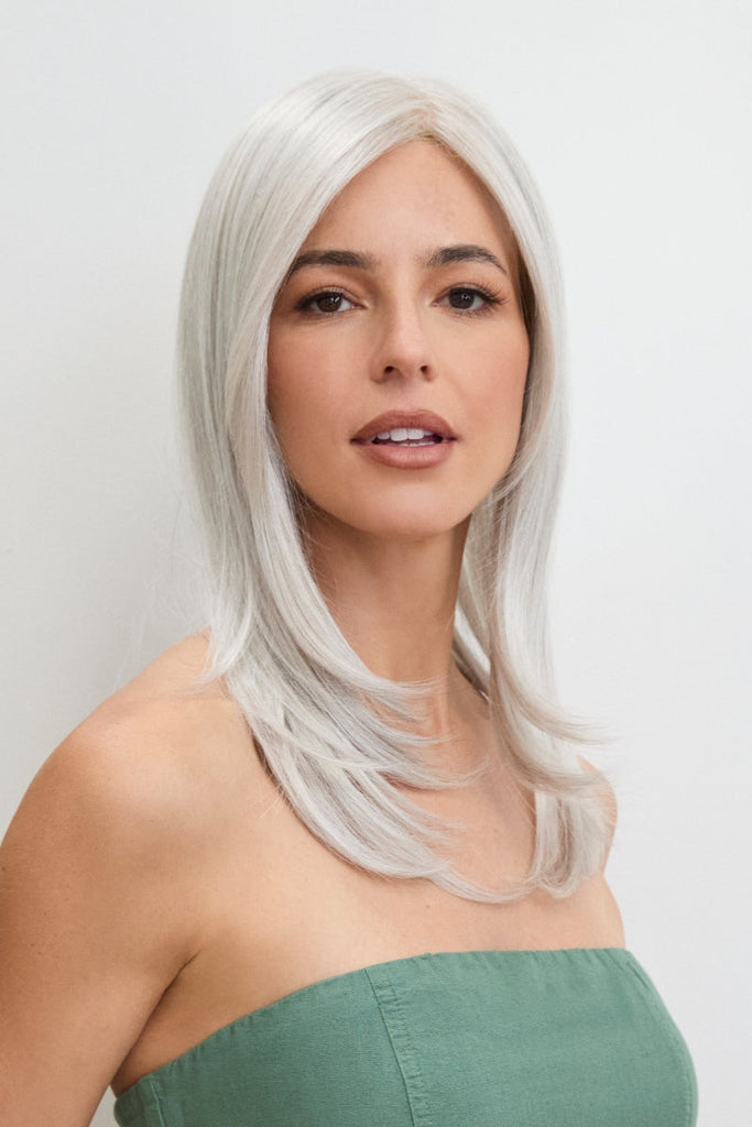 Close up of woman wearing a long length monofilament top piece.