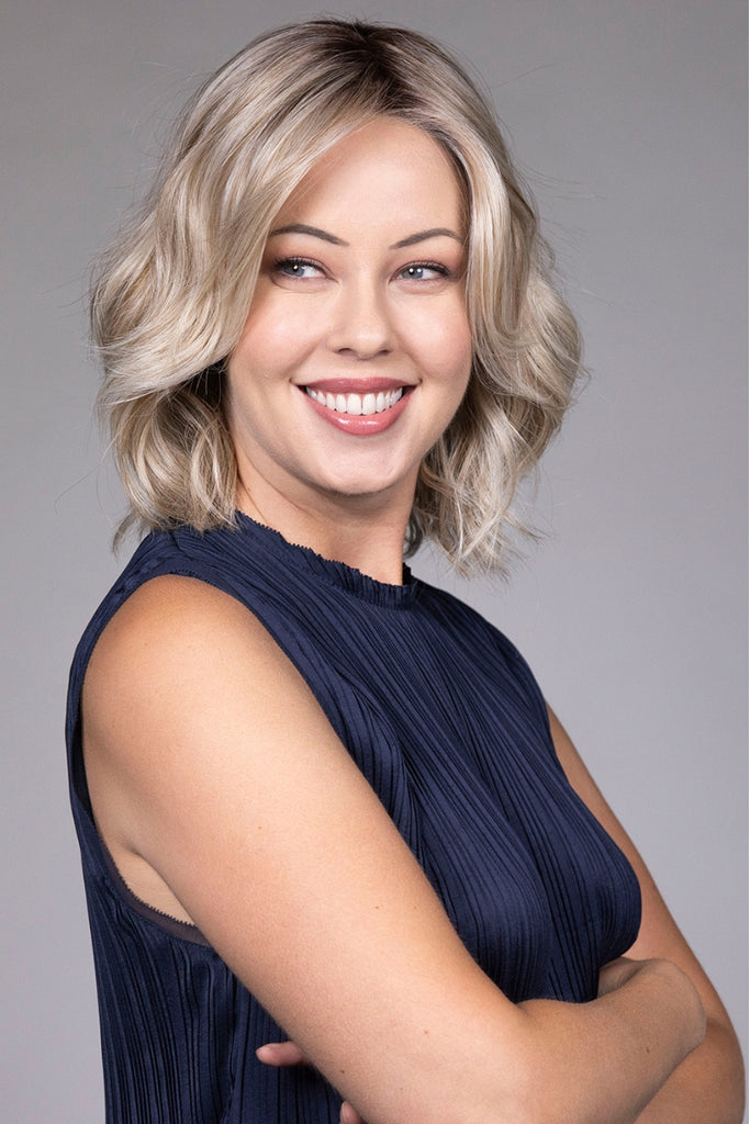 Woman wearing a wavy bob.