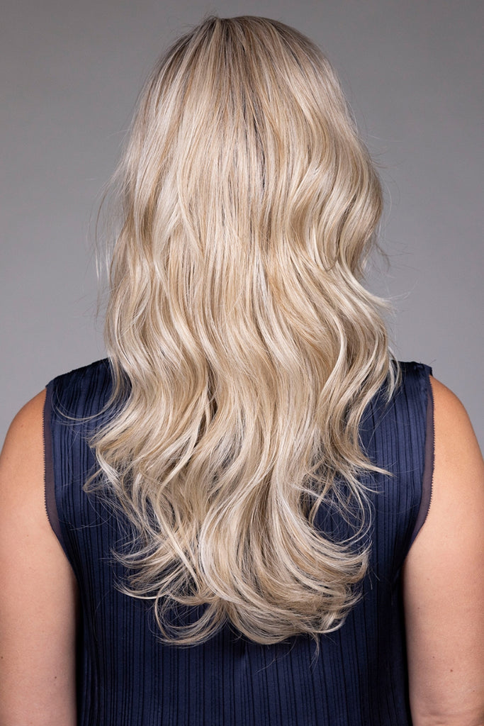 Back of model styling the color Butterbeer Blonde.