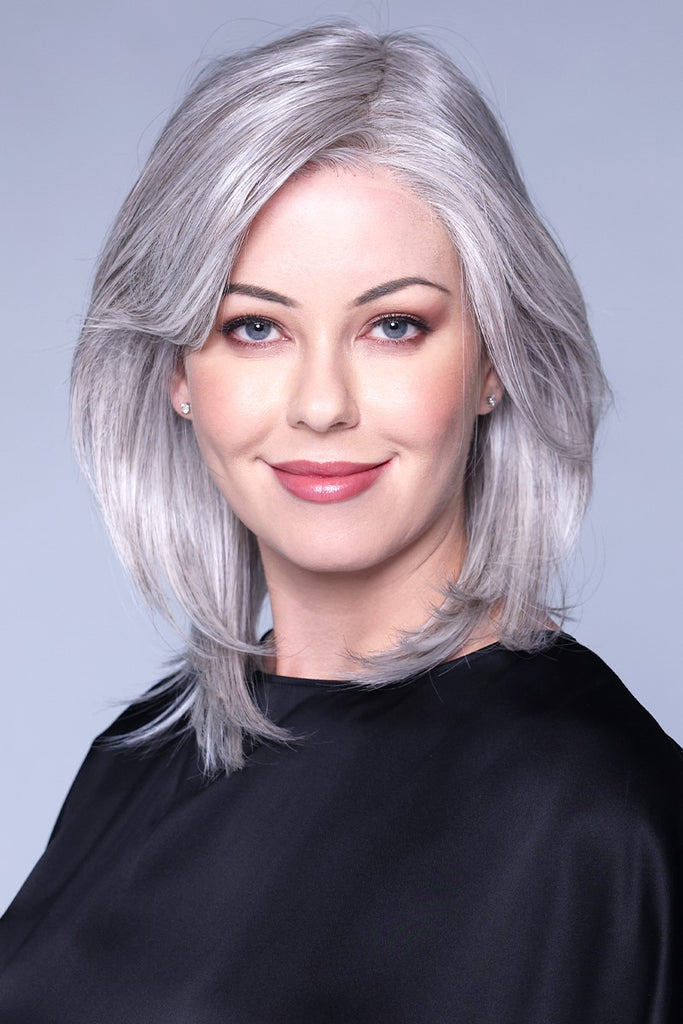 Model styling Belle Tress Santa Barbara Wig in the color Oyster Grey.