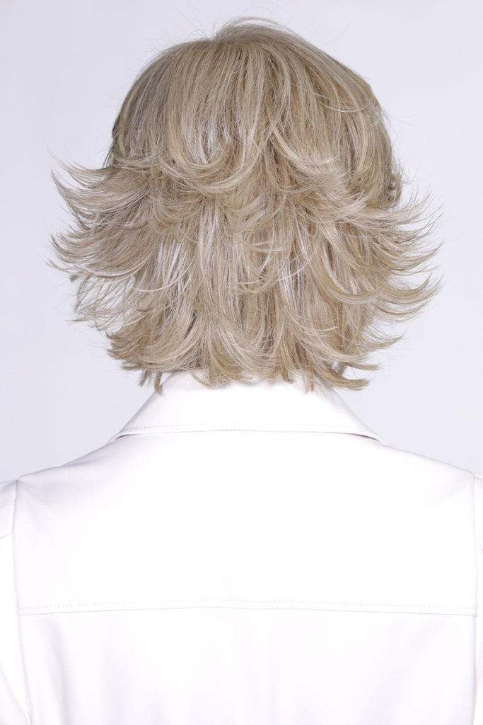Back of Torino revealing a full view of a pale blonde with golden blonde highlights.