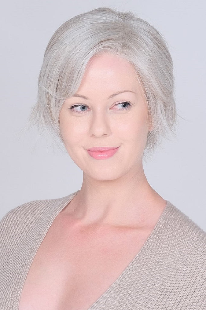 Women wearing a light, feathery layered wig by Belle Tress.