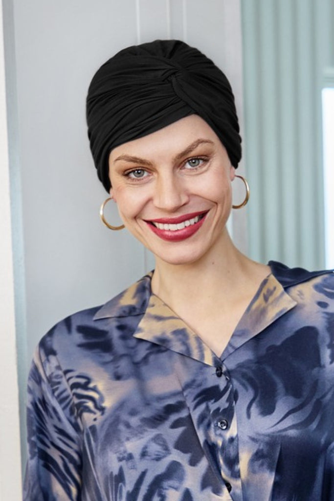 Model wearing Joyo Turban 1572 in the color black.