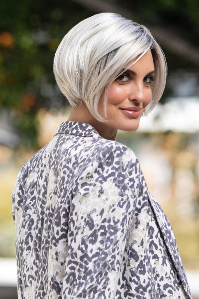 Model wearing the straight synthetic wig from Envy.