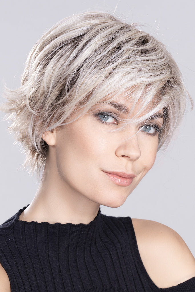Photo of a woman wearing Relax, a short wig from Ellen Wille's High Power Collection.
