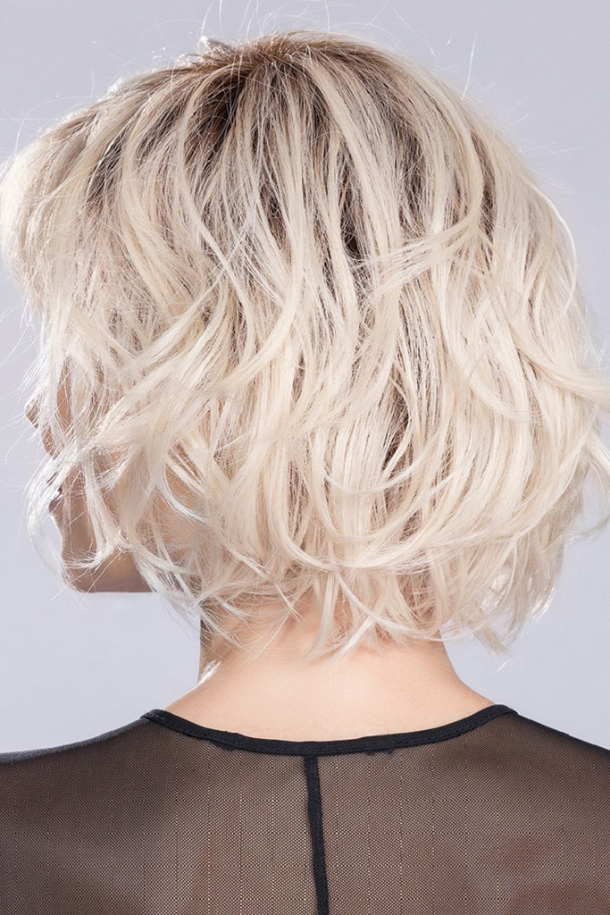 Back view of the wavy bob in the color Light Champagne Rooted. 