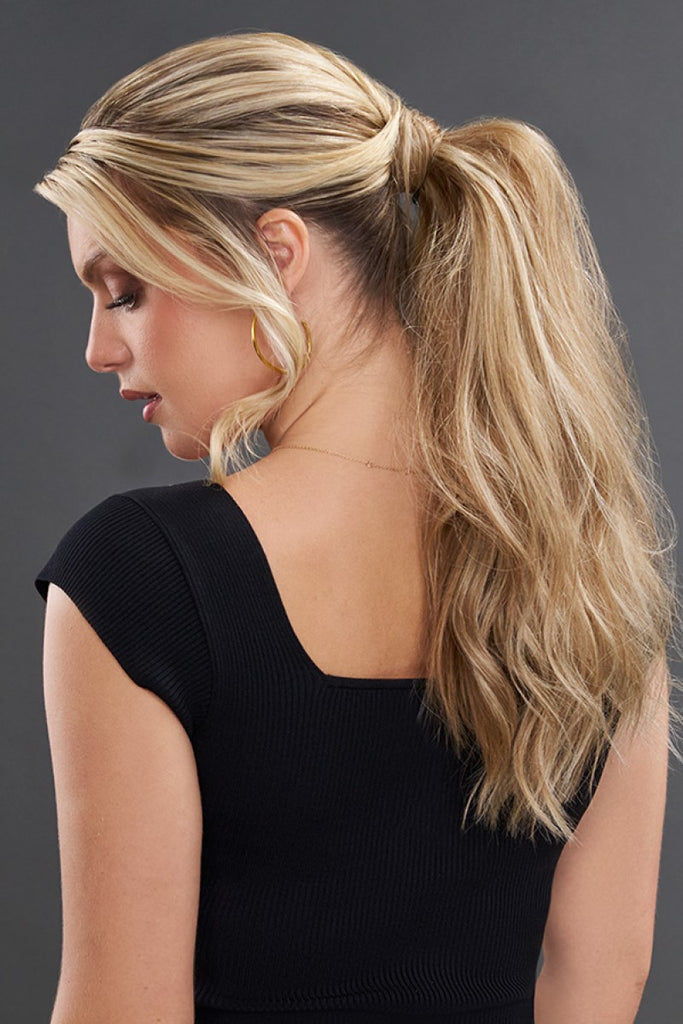 Back of model wearing a ponytail wrap showing the enhanced length and increased volume. 