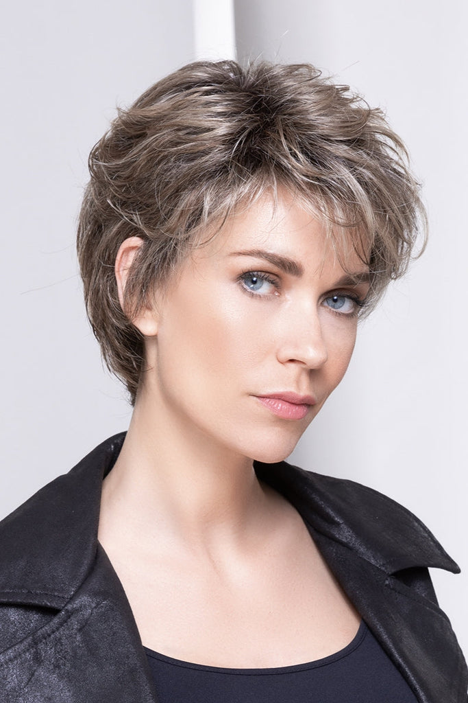 Model wearing a short pixie cut wig.