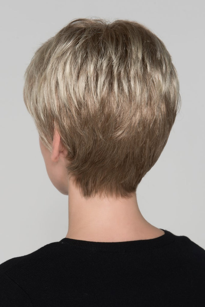 Back of Carol, revealing the feathered cut, long length top pixie cut wig.