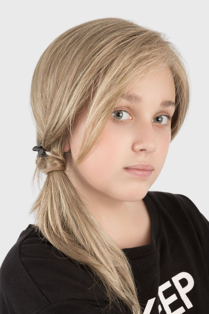 Close up of girl styling Sara wig in a side pony tail showing the versatility of the this wig.