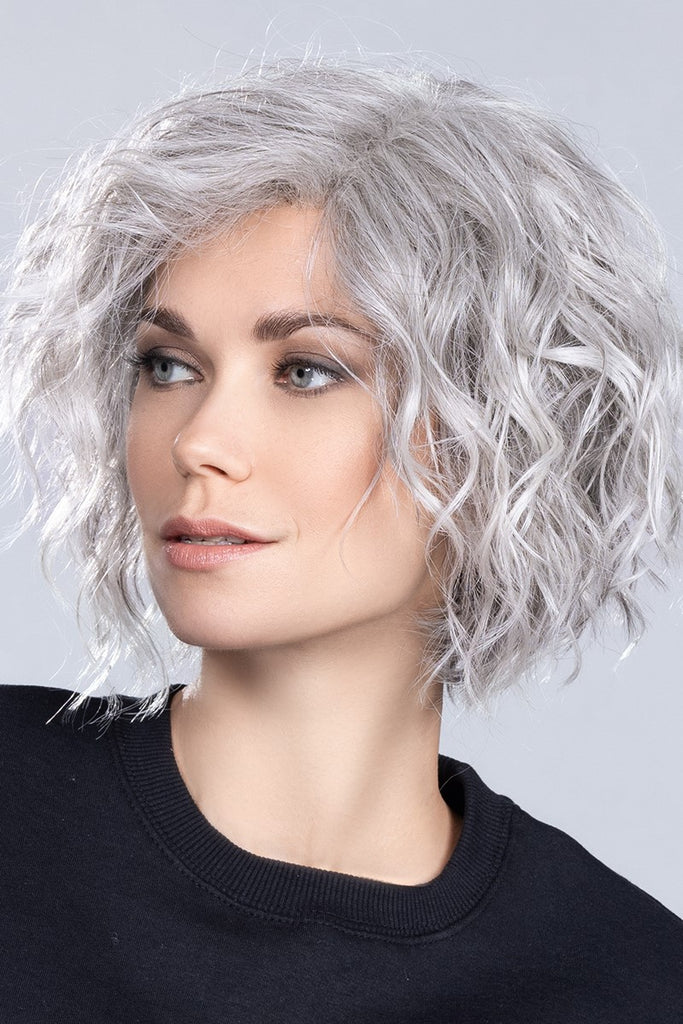 Side of model wearing a wig in the color Snow Mix by Ellen Wille.