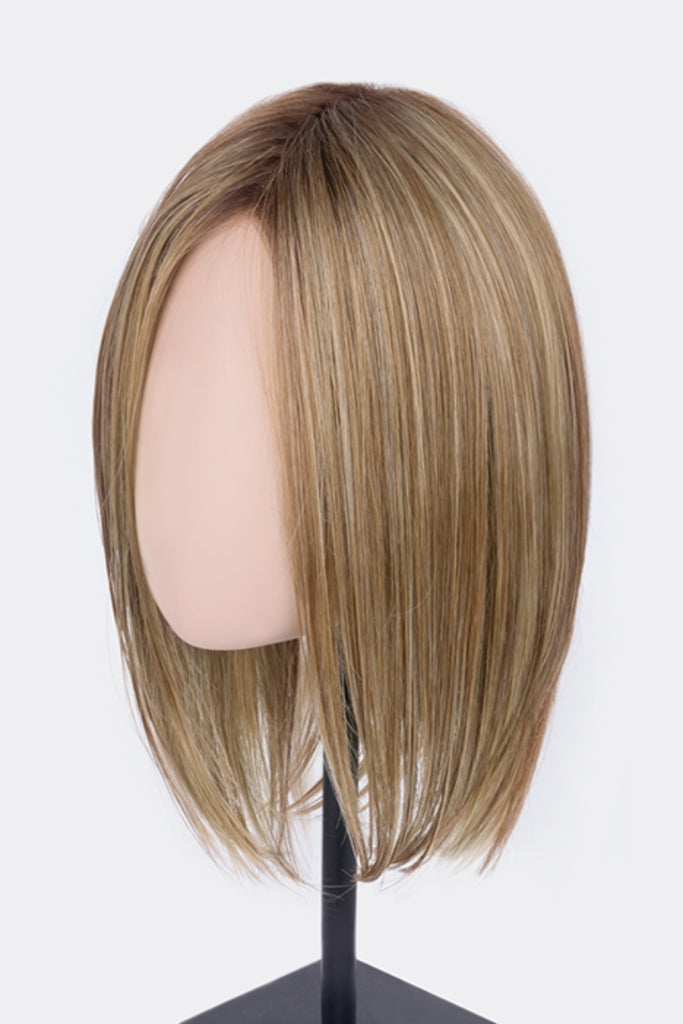 Side view of wig on mannequin in a light brown base with subtle light honey blonde and light butterscotch blonde highlights and dark roots.