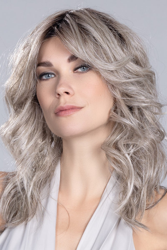 Model wearing Ellen Wille wig Voice styled with curls.