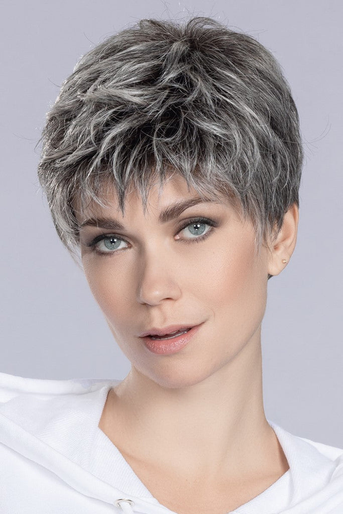 Women wearing a blend of steel grey, light grey and pure white with a dark rooting.