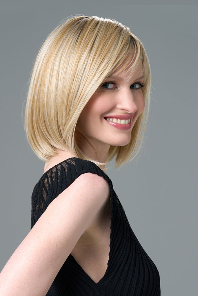 Woman wearing a sleek, medium-length bob.