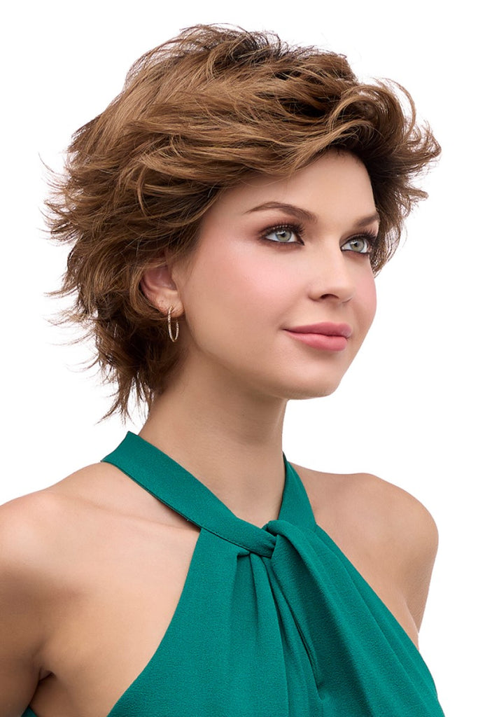 Side view of women wearing a voluminous mid-length style with face framing layers.
