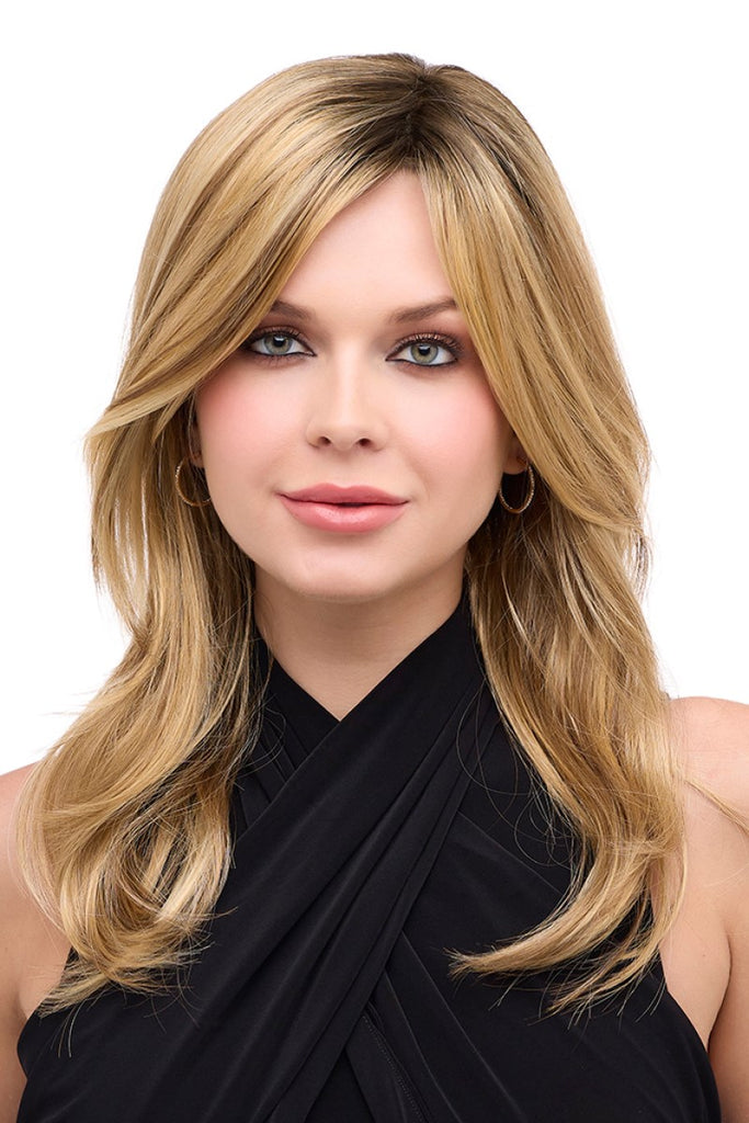 Front view of women styling a collarbone length wig with face framing layers.
