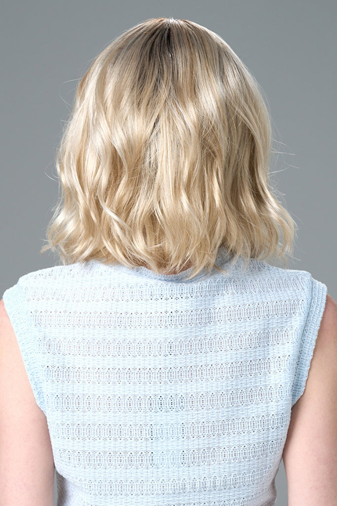 Back of model wearing a medium length bob wig.