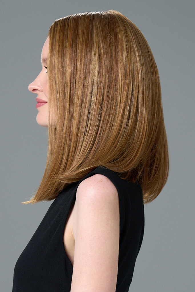 Side of model styling a straight wig.