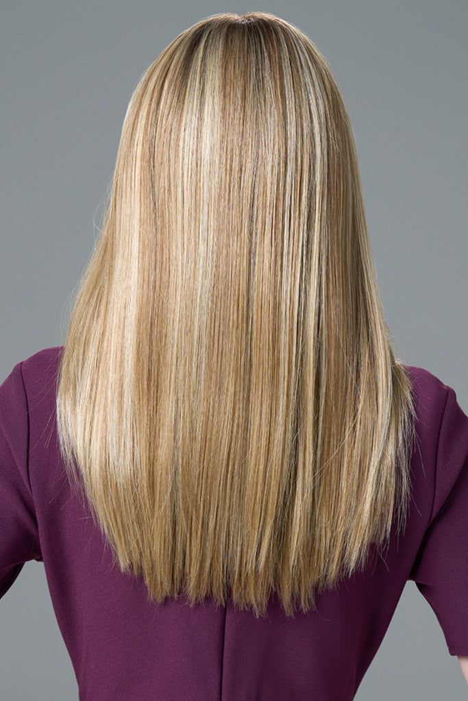Back of model wearing a long straight wig.