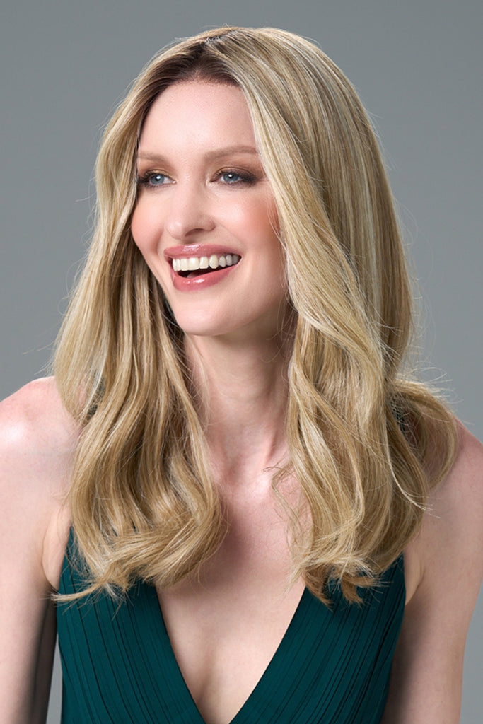 Front of model styling a slight waved wig.