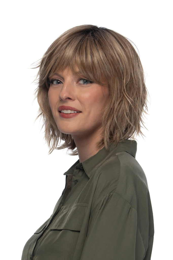 Side of women wearing a medium length wig.