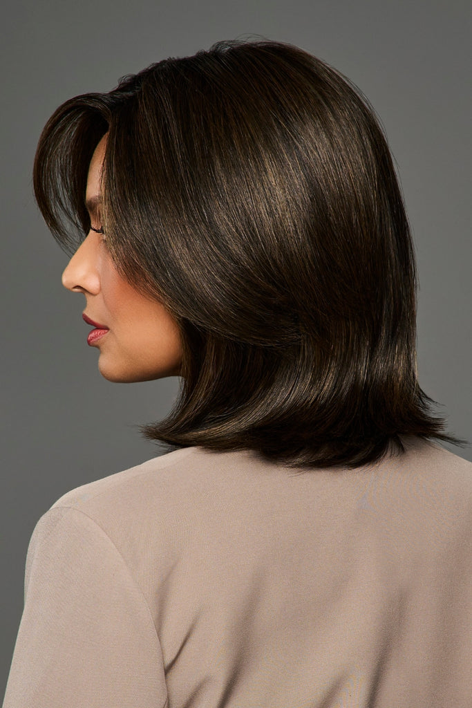 Side view of model wearing a dimensional, dark brunette color.