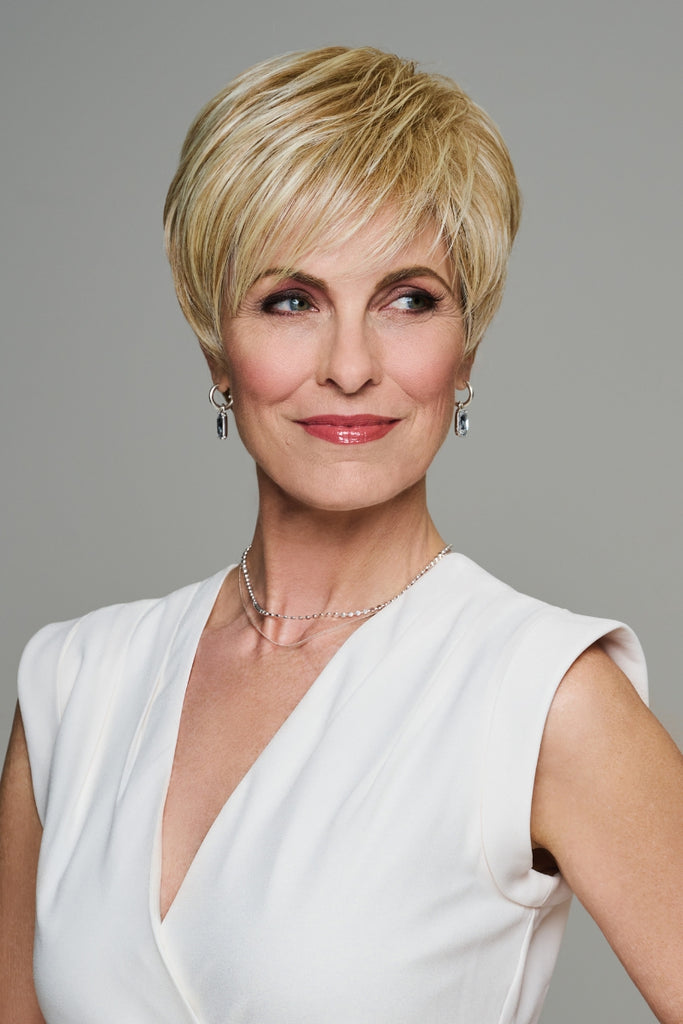 Woman styling Dream Debut by Gabor wigs.