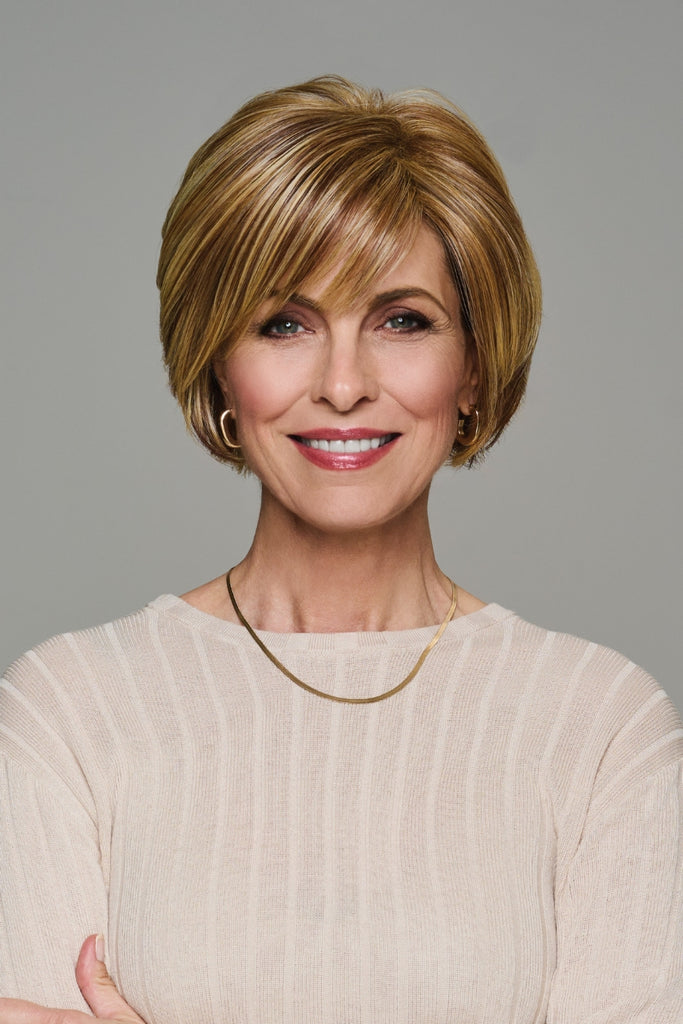 Woman styling Whirl by Gabor wigs.