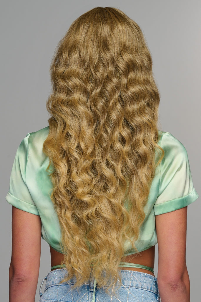 Back view of a woman wearing Curly Girlie in the color Buttered Toast (R1416T).