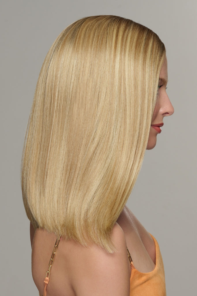 Side view of a woman wearing the shoulder length style.