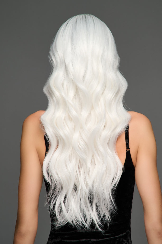 Back of woman wearing a long layered wig.