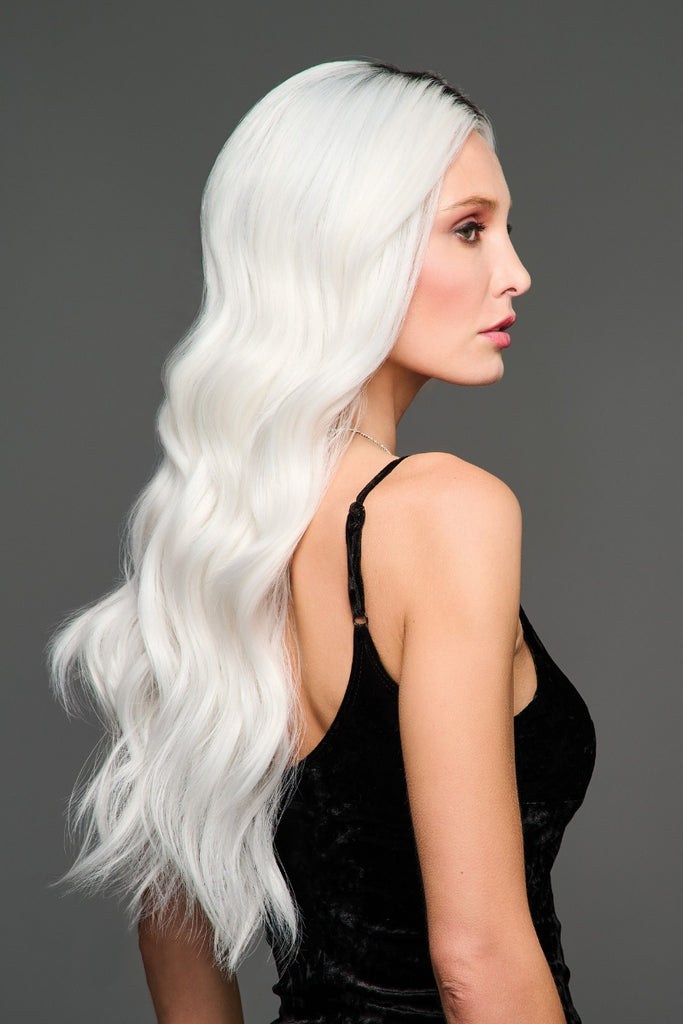 Side of model wearing a long wavy style.