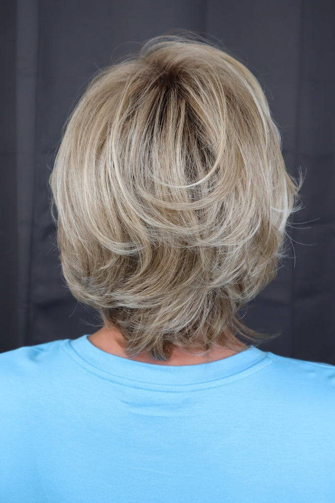 Back of model styling the color 12FS8 (Shaded Praline).