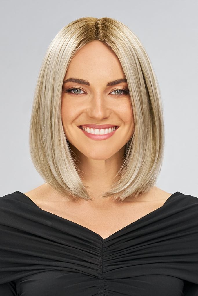 Close up women wearing a bold, timeless and trendy bob in the color FS17-101S18 (Palm Spring Blonde).