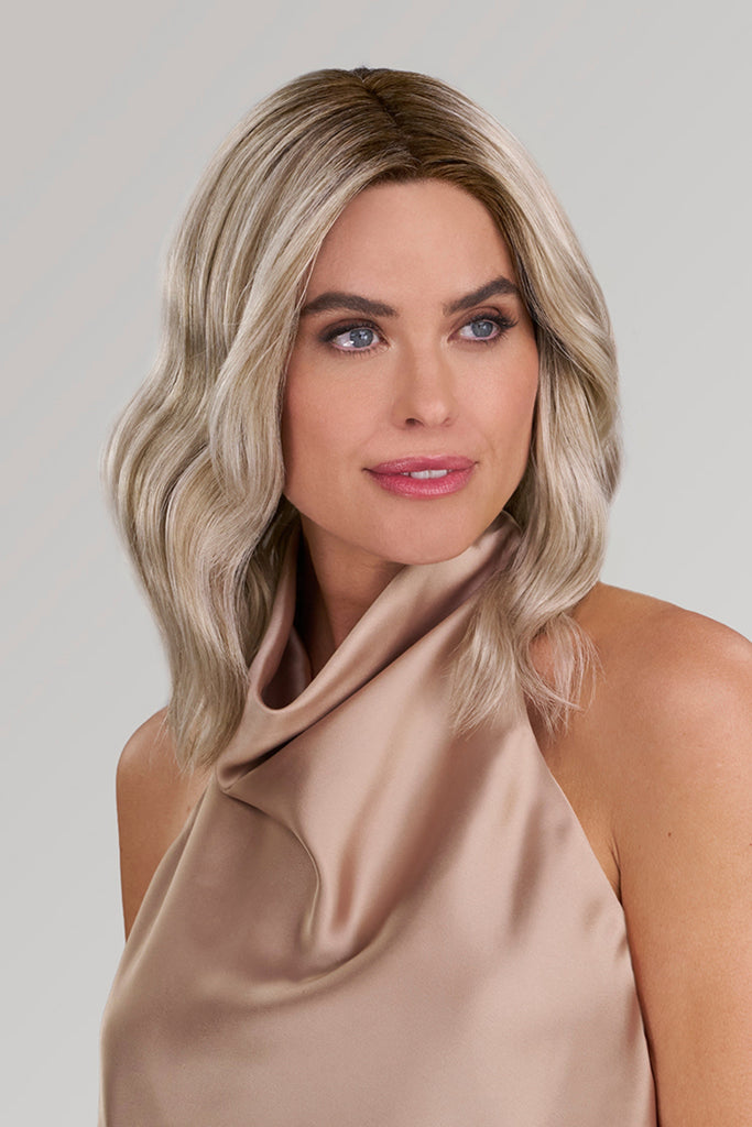 Woman styling the color FS17/101S18 (Palm Springs Blonde).