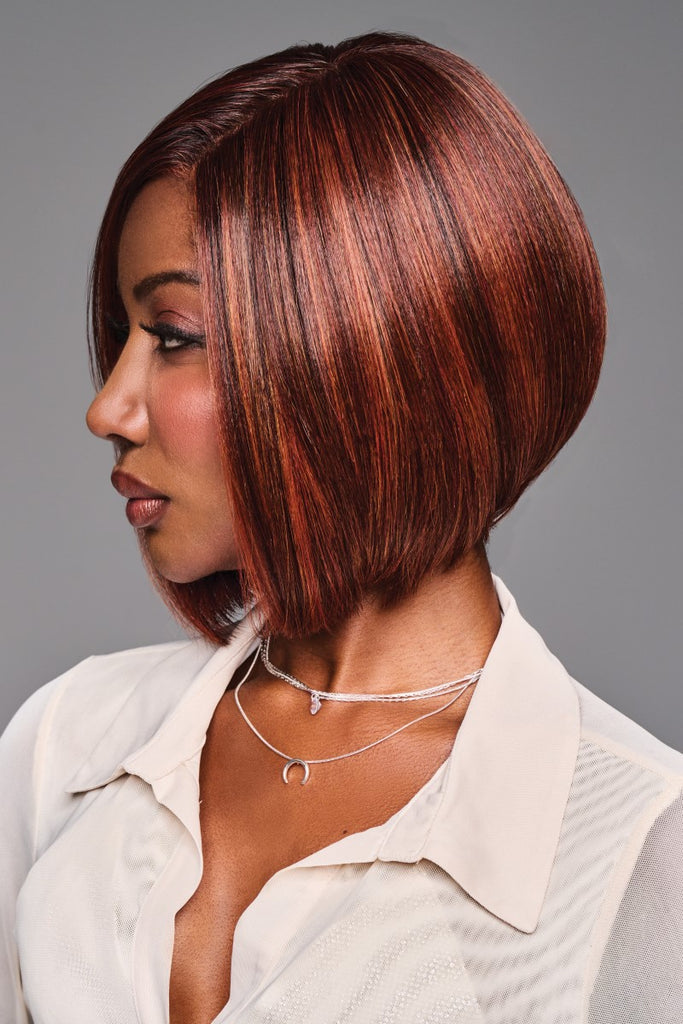 Side of women wearing a classy mid-length bob with a rounded stacked back.